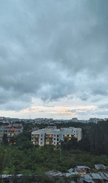 blog post featured image of a cloudy sky and a suburban appartment complex in the distance